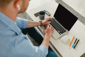 flat lay view from above on table workplace close-up man hands at home working photo