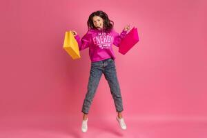 hispanic pretty woman in pink hoodie smiling jumping photo