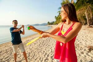 young hipster couple in love, tropical beach photo