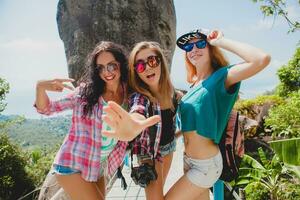 happy hipster company of friends traveling around world photo