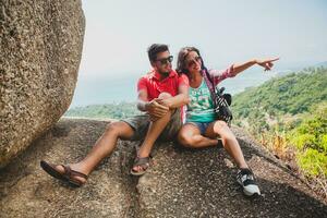 young happy hipster couple in love traveling around world photo