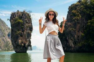 young beautiful woman traveling in thailand photo