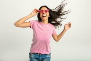 attractive woman in pink t-shirt and sunglasses photo