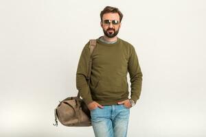 attractive stylish man traveler with bag photo