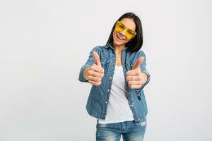 attractive woman dressed jeans and denim shirt wearing yellow sunglasses photo