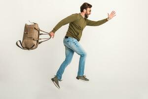 handsome bearded stylish man jumping running photo