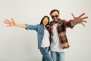 stylish man and woman in casual denim hipster outfit having fun photo