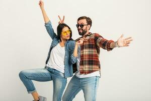 stylish man and woman in casual denim hipster outfit having fun photo