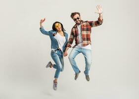 stylish man and woman in casual denim hipster outfit having fun photo