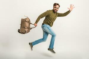 handsome bearded stylish man jumping running photo