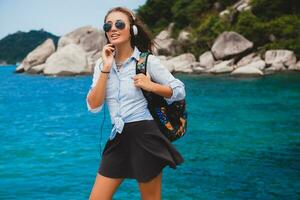 young stylish hipster woman traveling around the world photo