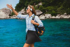 young stylish hipster woman traveling around the world photo