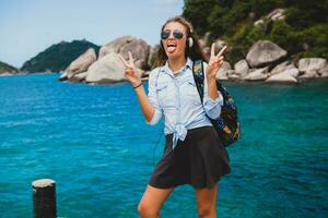 young stylish hipster woman traveling around the world photo