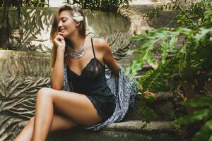 young slim woman in tropical Bali villa photo