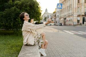 stylish beautiful woman walking in city street summer fashion trend photo