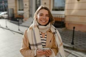 stylish woman walking in winter street photo