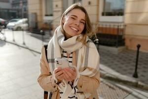 stylish woman walking in winter street photo