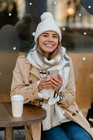 stylish woman walking in winter street photo