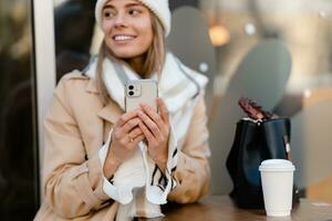 stylish woman walking in winter street photo