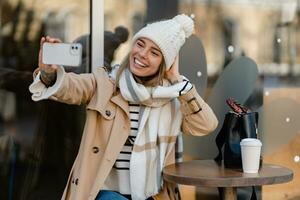 stylish woman walking in winter street photo