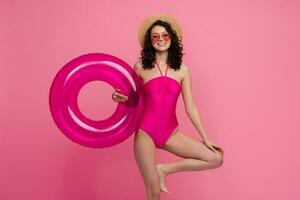 smiling slim happy beautiful woman in stylish swimwear wearing sunglasses photo