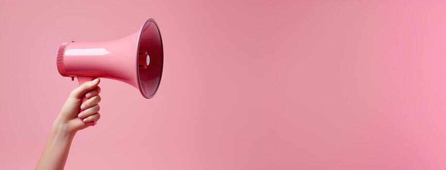 Generative AI, megaphone in hand on a empty pink background, panoramic image with copy space photo