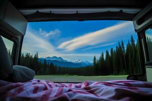 Mountains and pine trees scene seen by camper inside camper van. photo