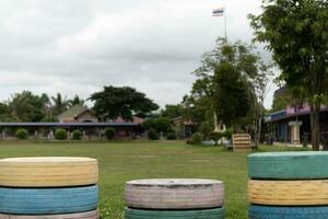 Multi-colored rubber tires arranged in a row It is a jumping place for children to enhance their development. photo