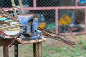 Old hand tools that are placed outdoors without people using them until they rust. photo