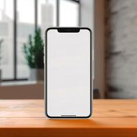 a white screen cell phone on a wooden table photo