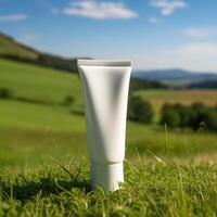 white cream tube on grass on the terrain photo