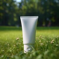 white cream tube on grass on the terrain photo