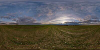 spherical 360 hdri panorama among farming field with clouds on evening blue sky after sunset in equirectangular seamless projection, as sky dome replacement in drone panoramas, game development photo