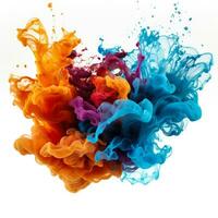 Vibrant paint splashes merging in water isolated on a white background photo