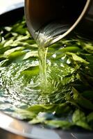 Tea leaves unfurling delicately in hot water creating a captivating infusion photo