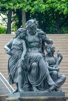 Dresden, Germany -  Artistic statues in front of Supreme Land Court palace in Dresden and Elbe river bank photo