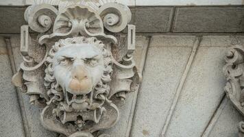 Dresden, Germany - Ancient decoration element of scary lion head in downtown historical center of Dresden, Germany photo