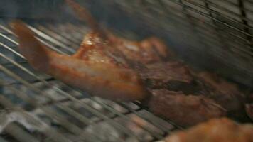 Meat grilling. Putting pices on grill grate. Slow motion video