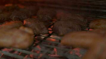 Meat grilling. Putting pices on grill grate. Slow motion video