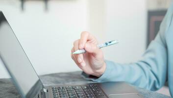 Woman typing work on laptop Suitable for making infographics. photo