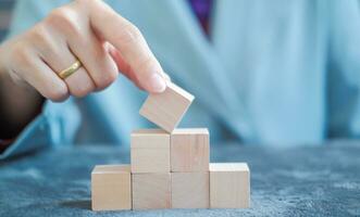 hand holding wooden dice Suitable for making infographics. photo