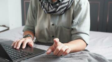 woman pointing finger and working with notebook Suitable for making infographics. photo