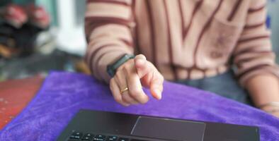 woman pointing finger and working with notebook Suitable for making infographics. photo