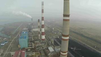 Power plant area and smoking pipes, aerial view video