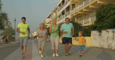 Cheerful big family going in for sport together video