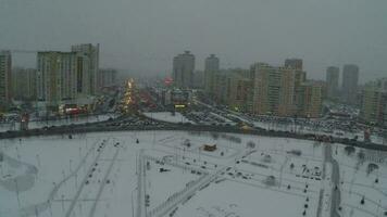 Winter city and Happy Birthday on snow, aerial view video