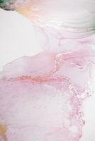 Painting created with alcohol ink. Soft smooth color transitions combined with clear gold and silver edges. Blue, pink, green abstract color combination. photo