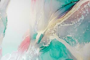 Painting created with alcohol ink. Soft smooth color transitions combined with clear gold and silver edges. Blue, pink, green abstract color combination. photo