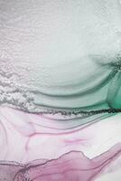 Painting created with alcohol ink. Soft smooth color transitions combined with clear gold and silver edges. Blue, pink, green abstract color combination. photo
