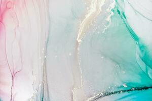 Painting created with alcohol ink. Soft smooth color transitions combined with clear gold and silver edges. Blue, pink, green abstract color combination. photo